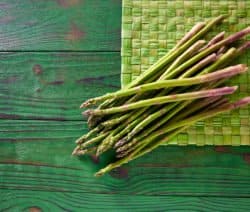 green asparagus fresh on wood table