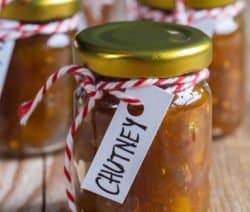 Onion pineapple chutney on rustic wood