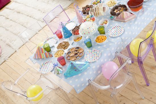 Birthday party table setting with food