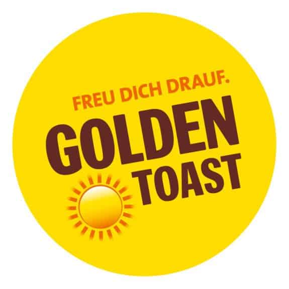 Gelber Kreis mit braunem Text 'Freu dich drauf. Golden Toast' und einer Sonne unten links.