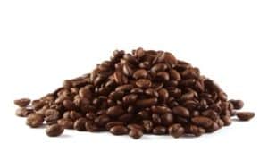 A pile of coffee beans shot on a white background.